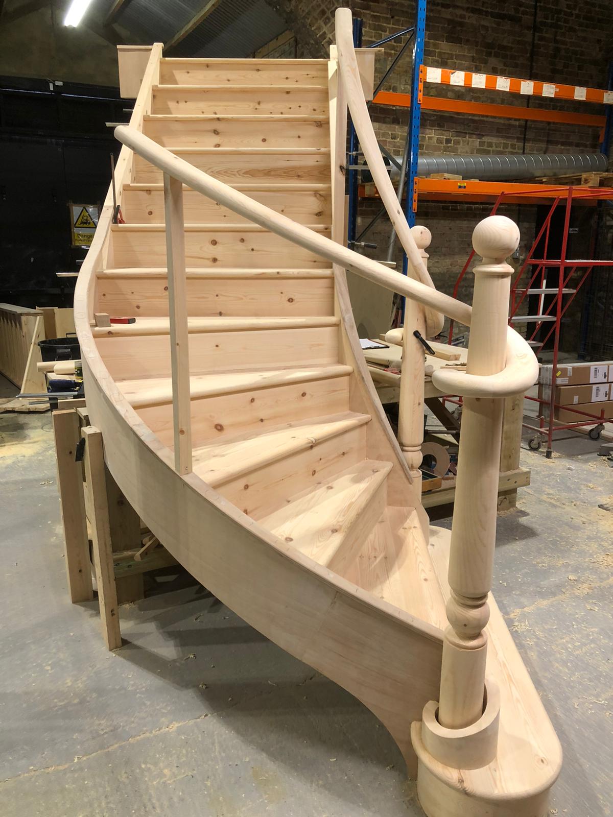 Bespoke staircase with curved oak handrail, London