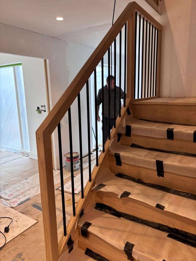 Modern oak staircase with black metal spindles 4