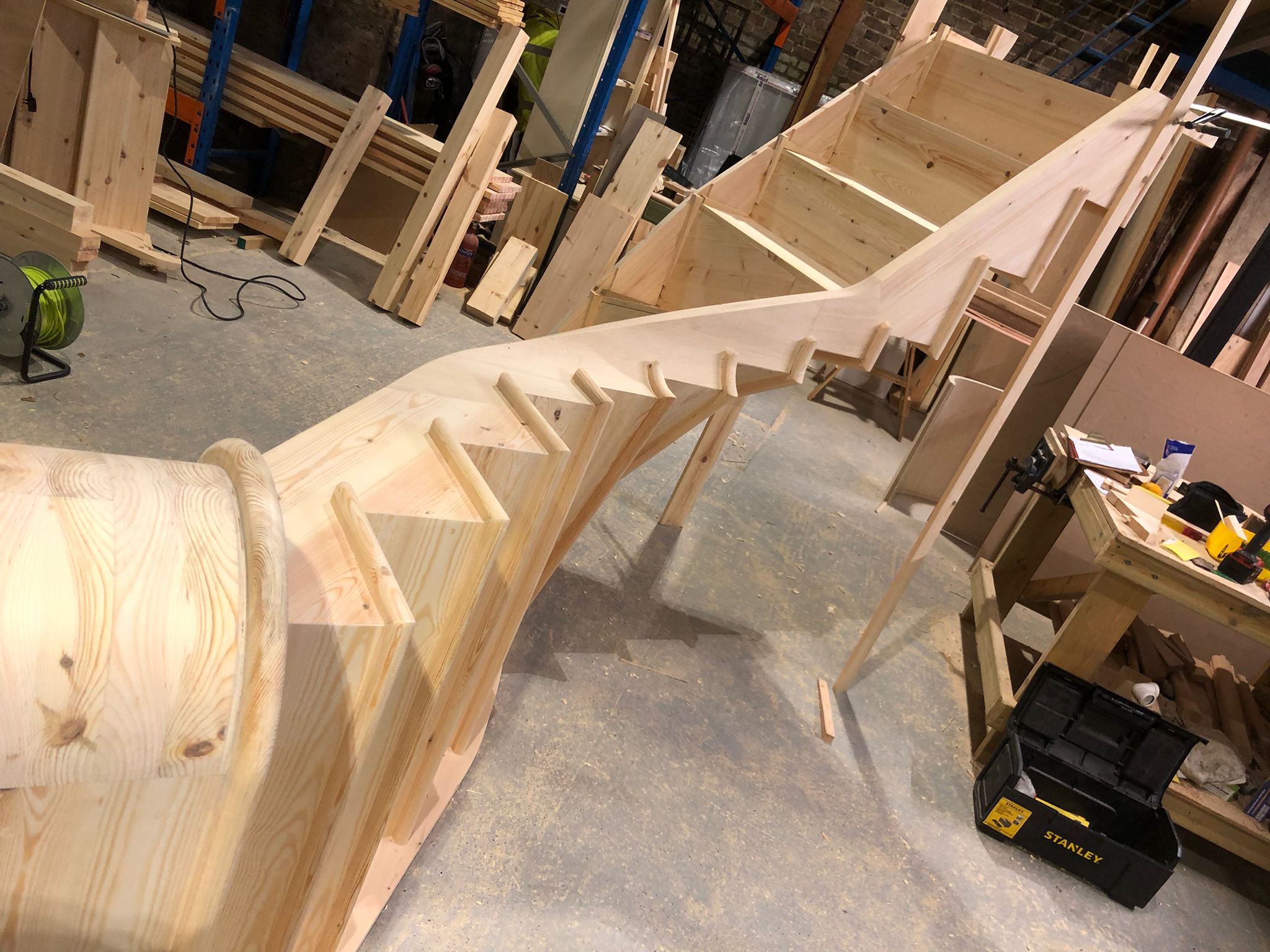 Softwood cut curved string staircase - Hertford
