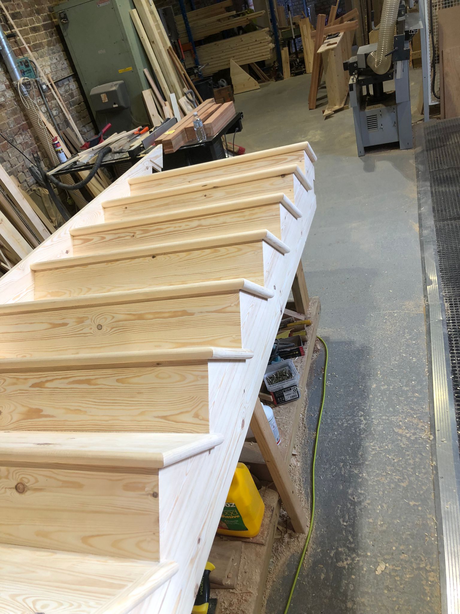 Softwood cut wreathed string staircase - London