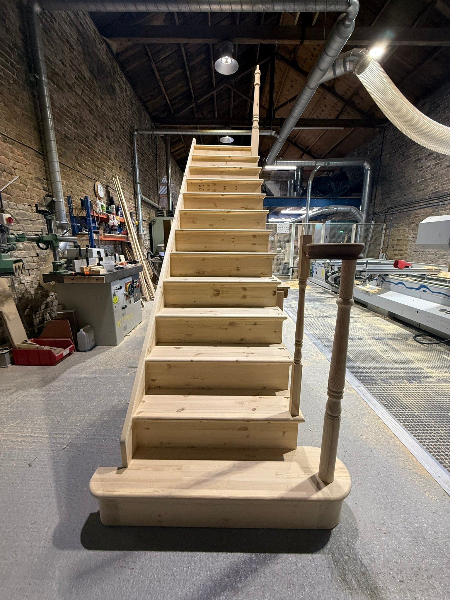 Timber cut string staircase London