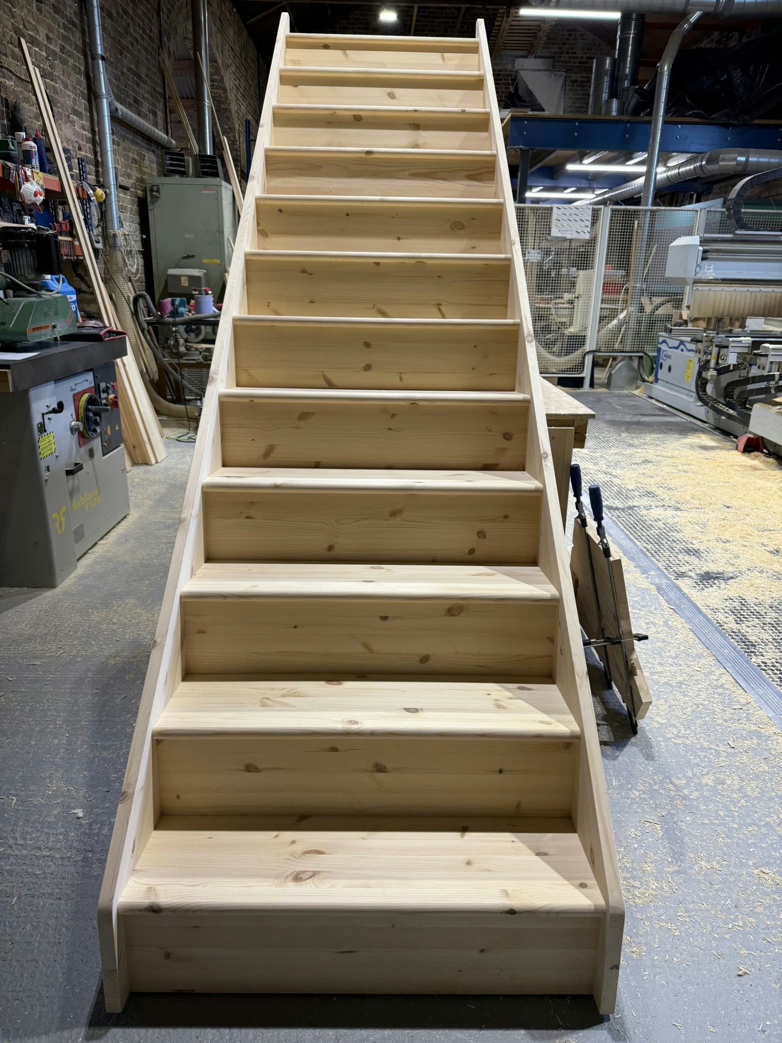 Wooden staircase in workshop setting