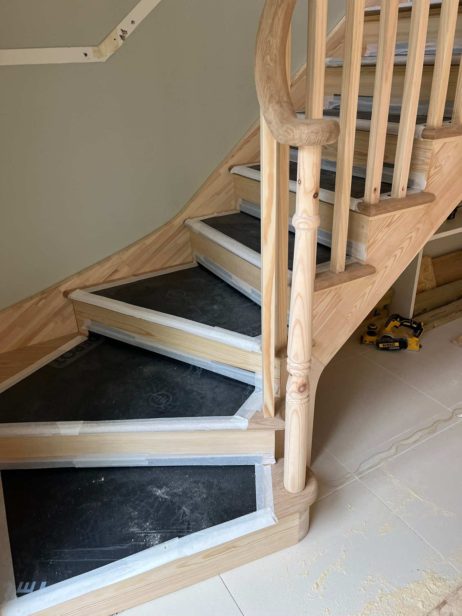 Bespoke curved staircase with oak handrails - London